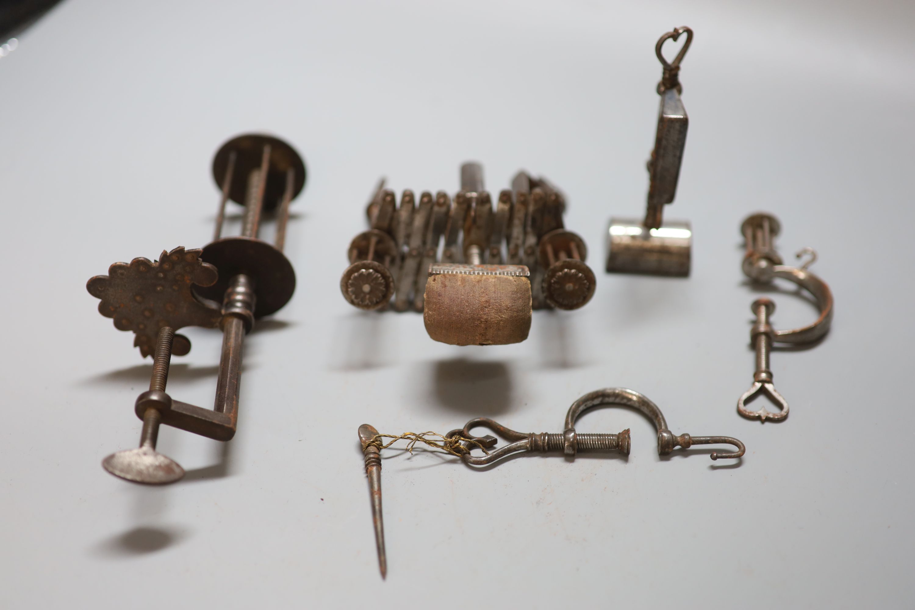 A group of four 18th / 19th century steel sewing clamps